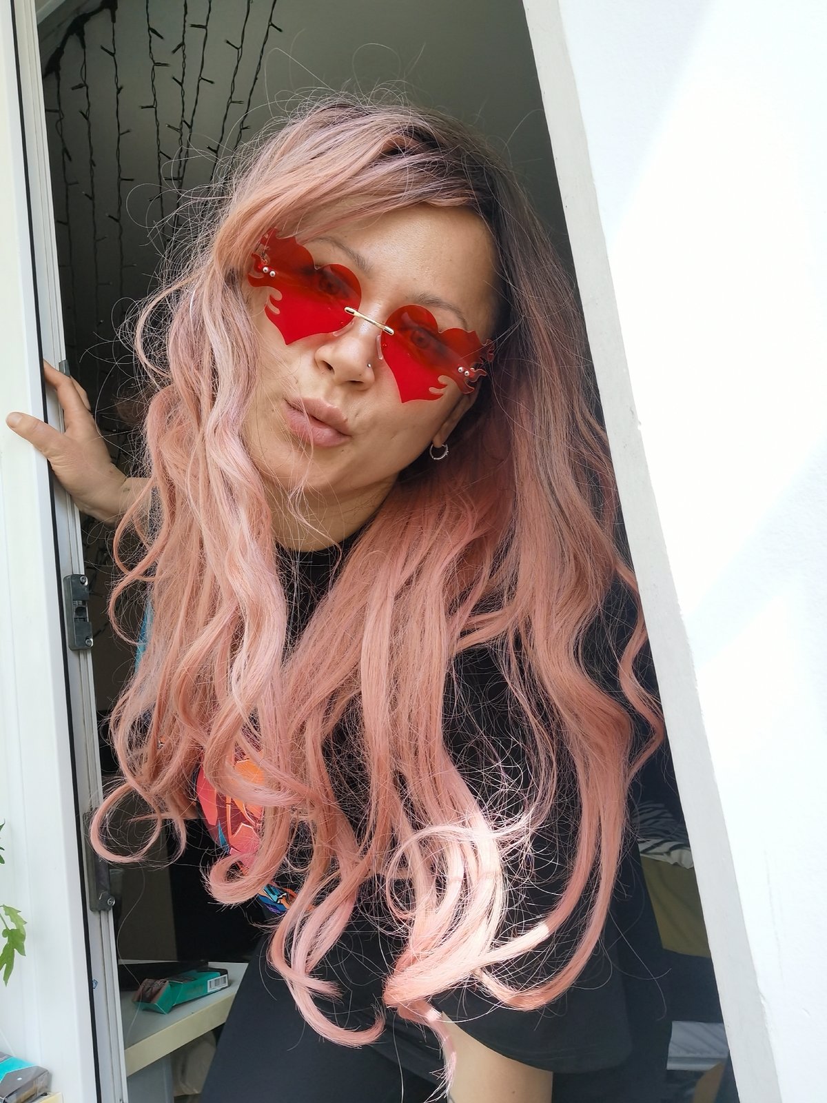 Pink-haired individual photographs selfies in Chaikovsky, Russia morning
