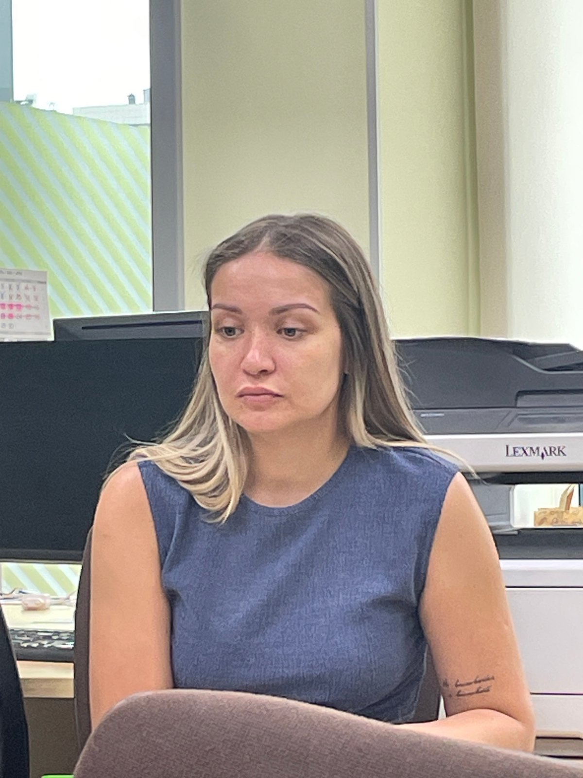Woman photographed twice in Krasnoyarsk office workspace