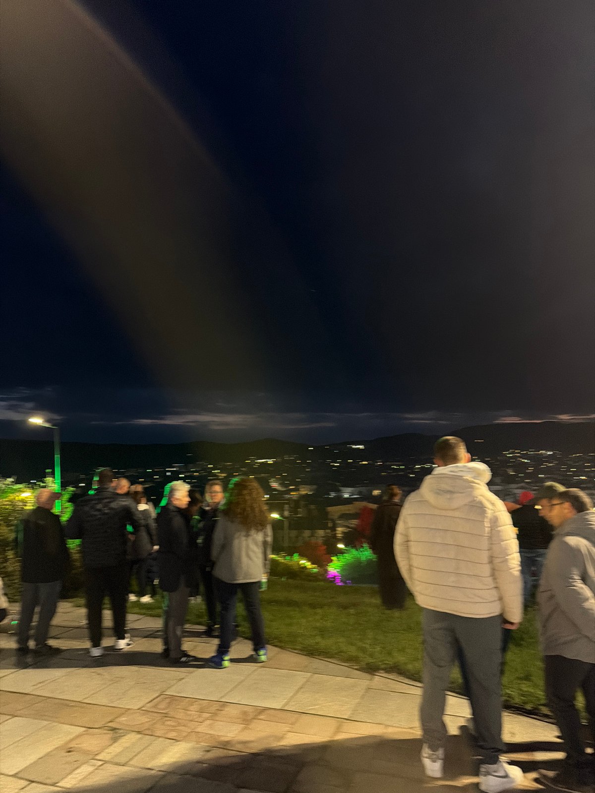 Evening visitors gather at Panagyurishte memorial complex at sunset
