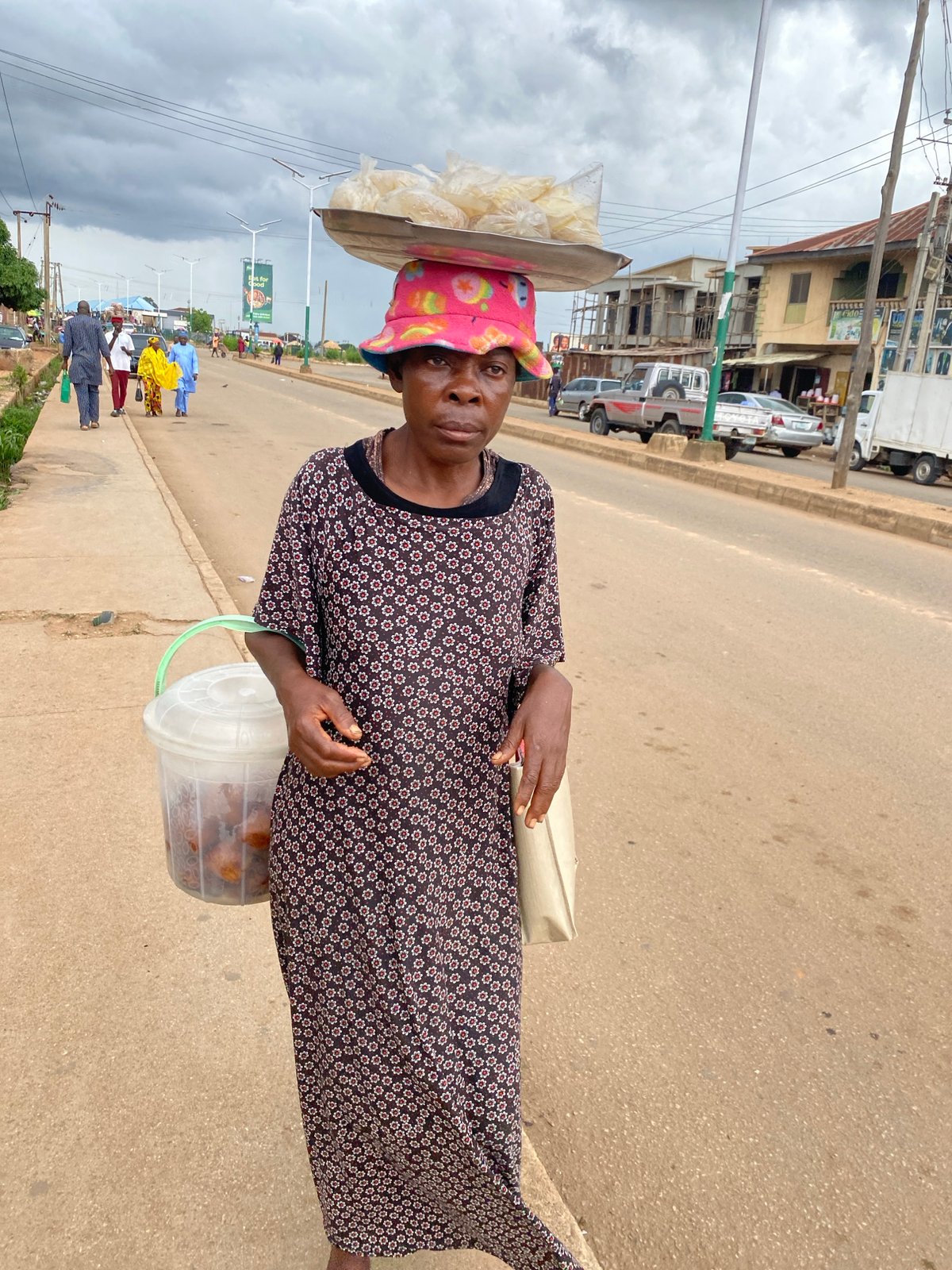 Busy street commerce and foot traffic in Bukuru, Nigeria