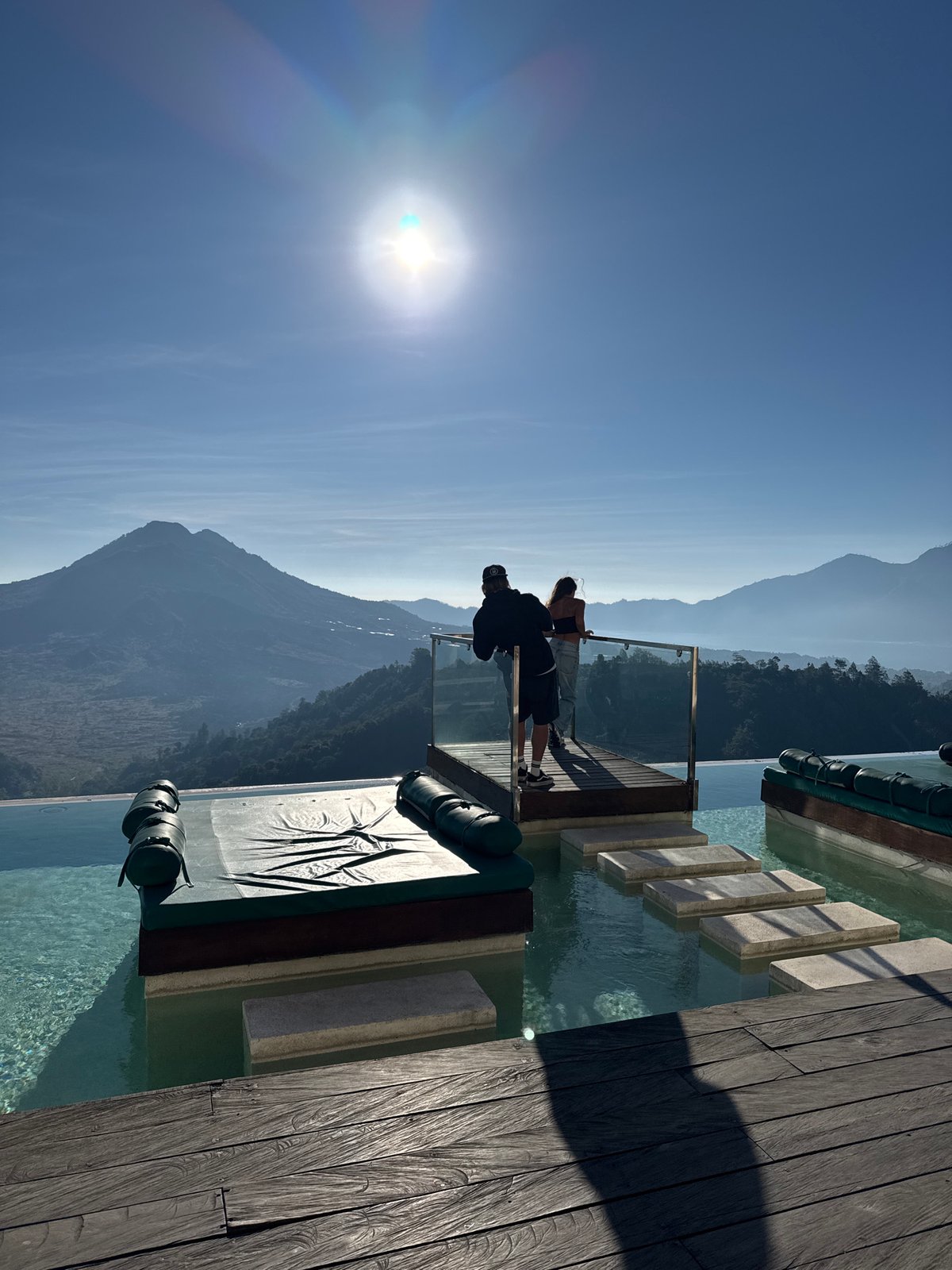 Two people spotted on Kintamani viewing platform overlooking volcanic mountains