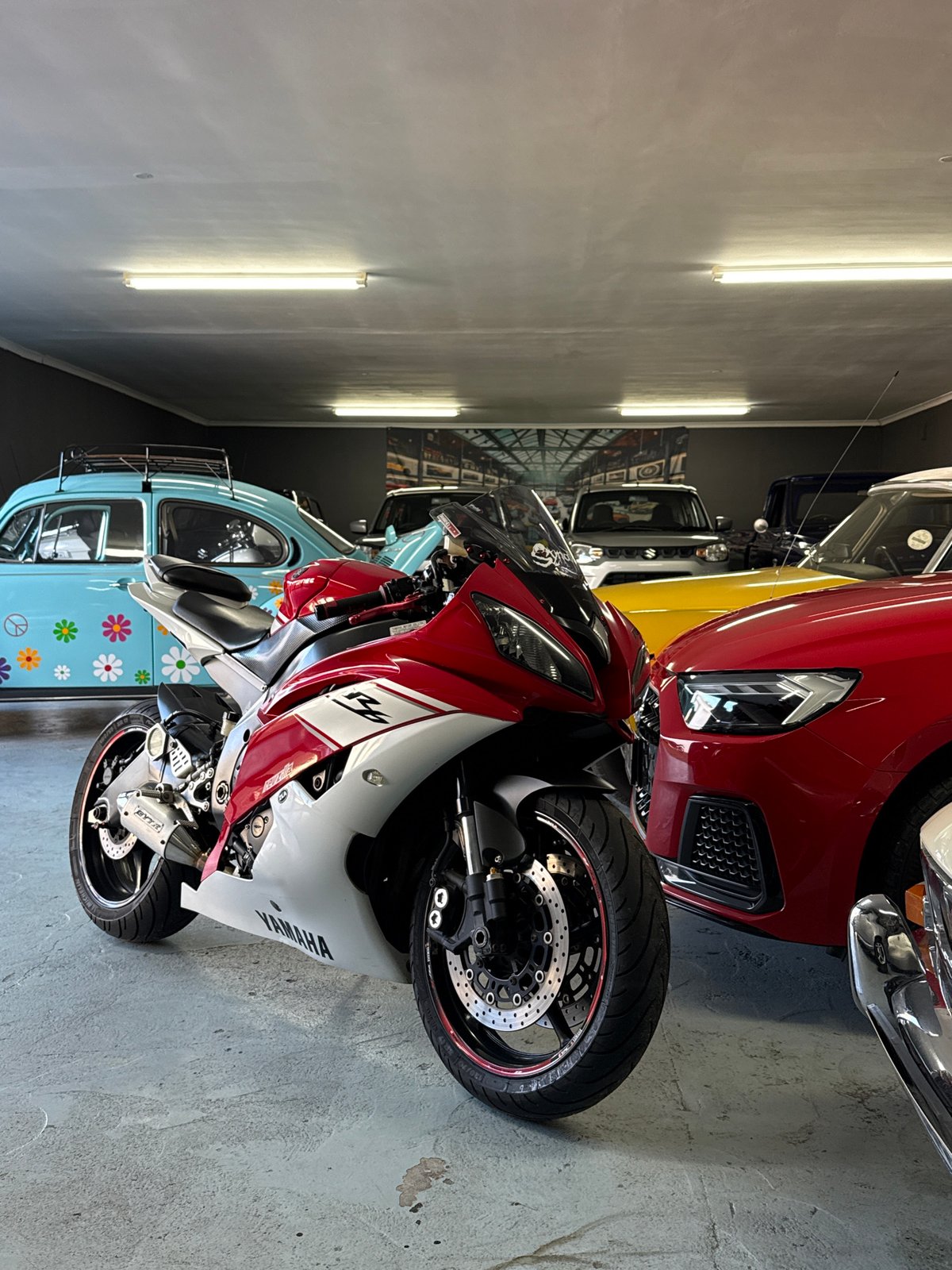 Red and white Yamaha R6 parked indoors, Cape Town garage