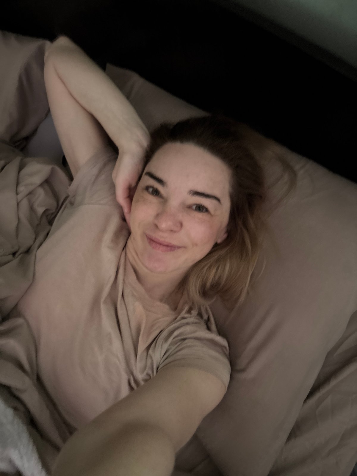 Person documented in medical setting and bedroom, Russia