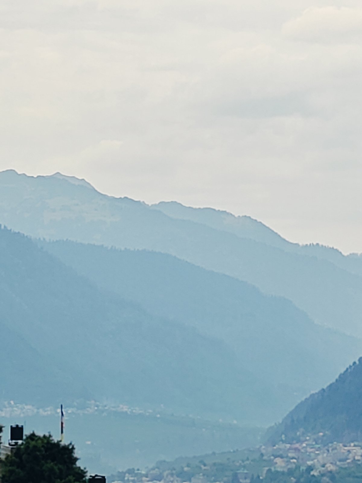 Vashisht village and valley under heavy monsoon cloud cover
