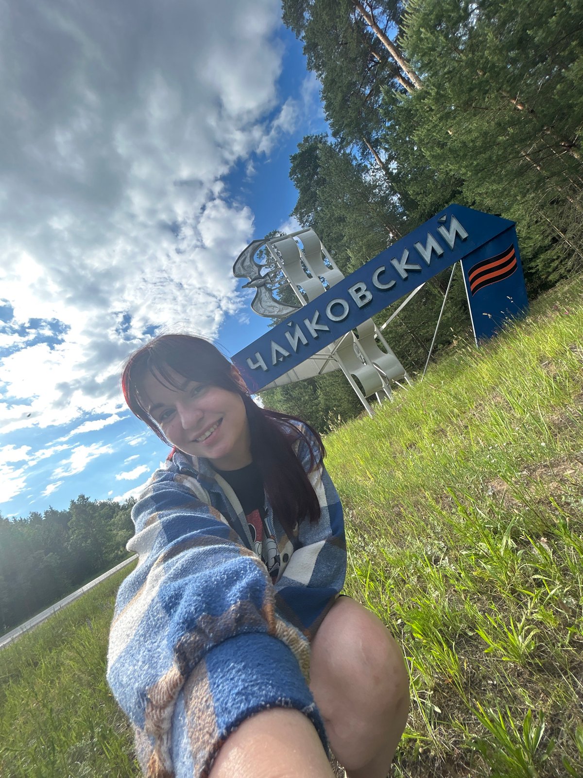 Visitors pose for photos at Chaikovsky city sign