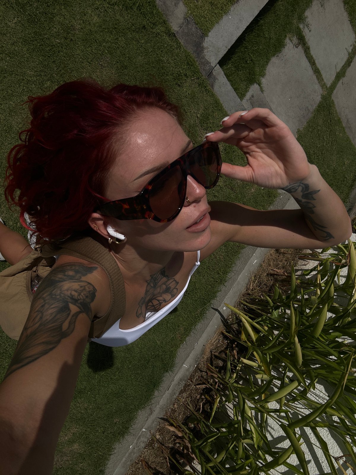 Red-haired woman poses for photos in North Kuta, Indonesia