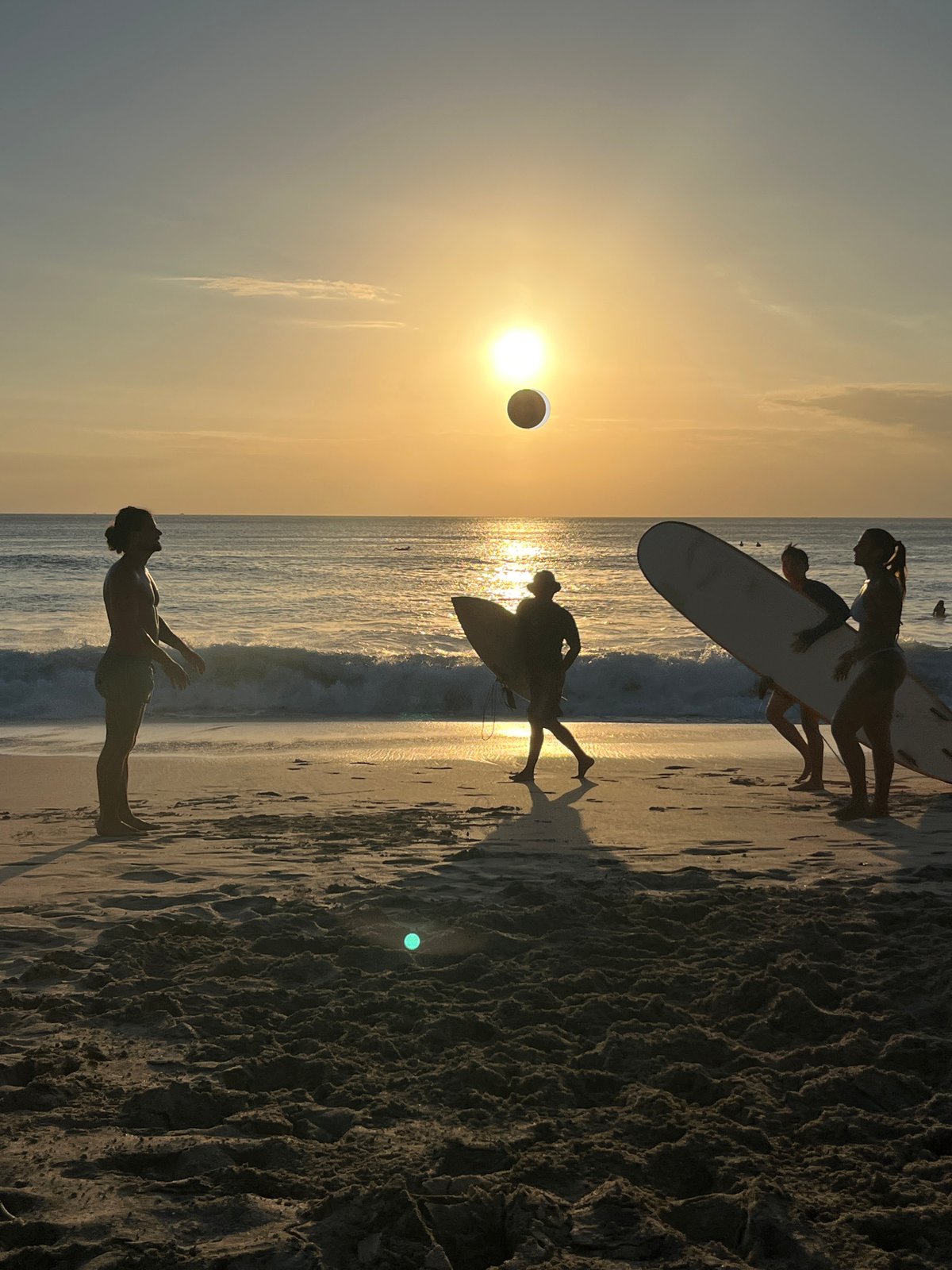 Sunset beach gathering with sports and dogs in Kuta Selatan