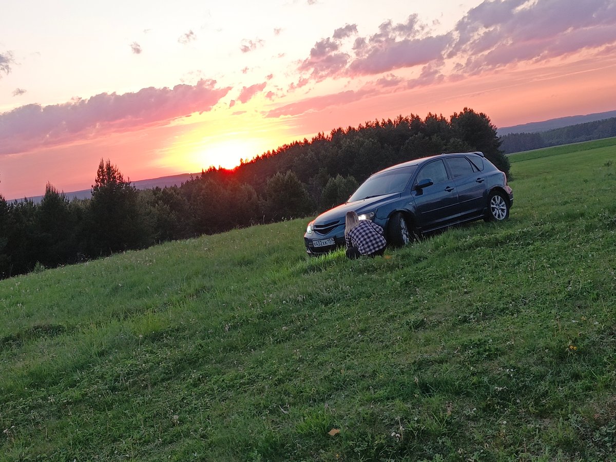 Car break during sunset viewing in rural Russia