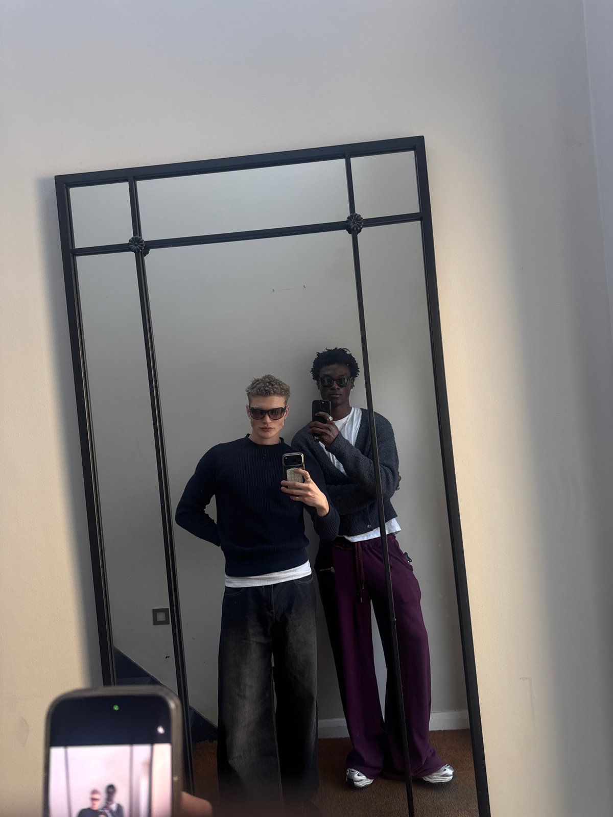 Two people take mirror selfie in London