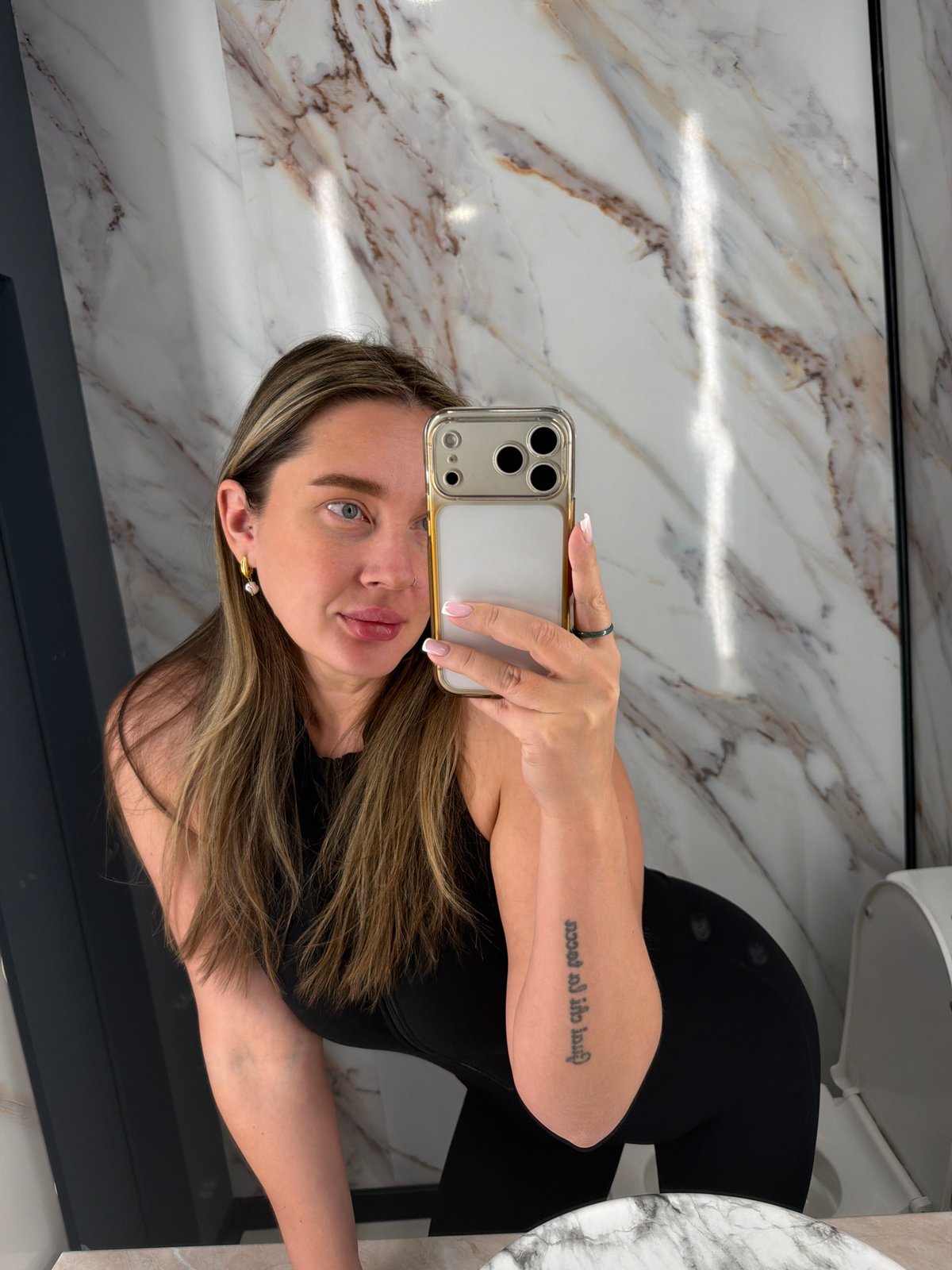 Woman takes bathroom selfie in Moscow