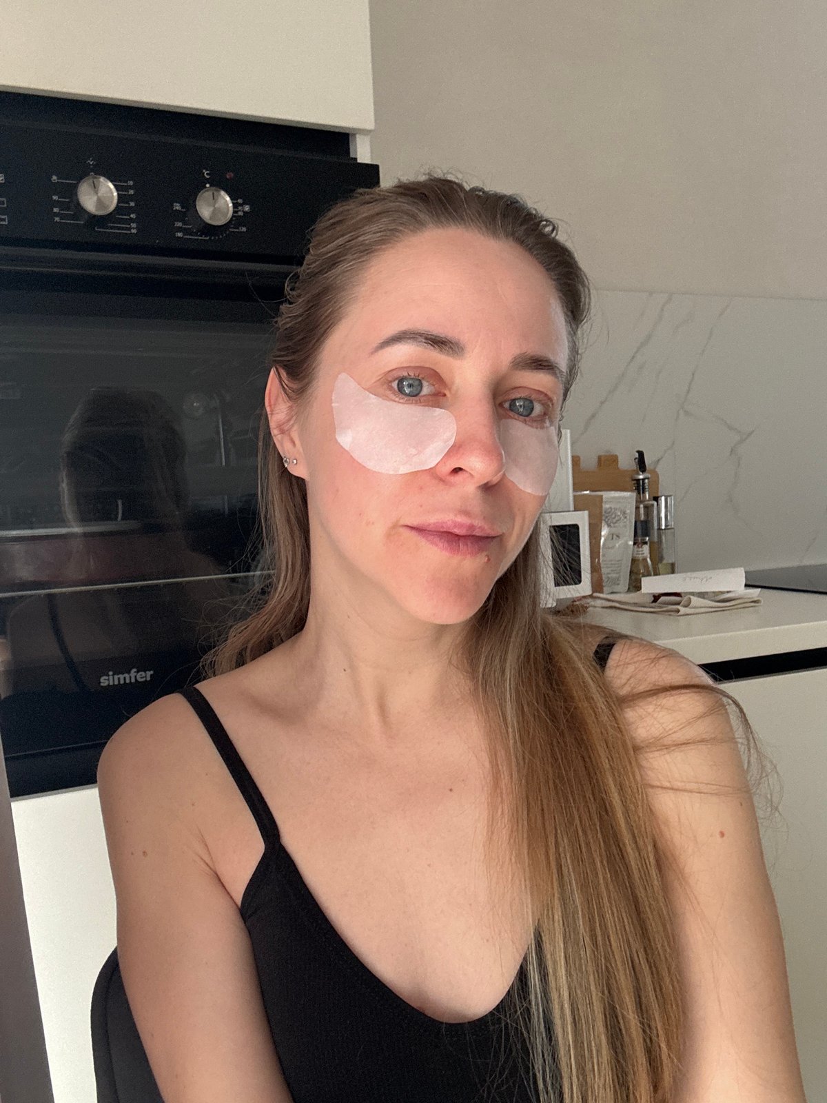 Woman's morning skincare routine documented in Chaikovsky kitchen