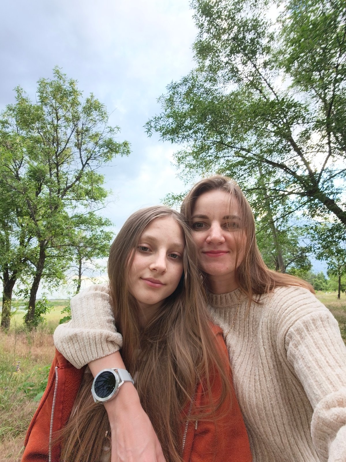 Wildflowers and storm skies along a Kryvyi Rih riverbank