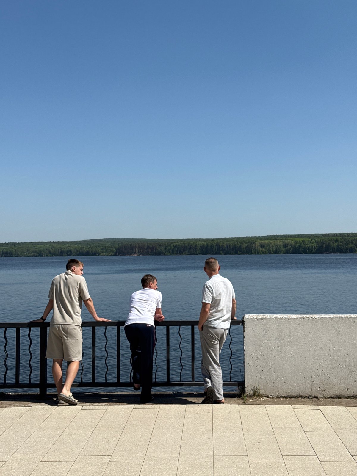 Morning waterfront activity documented along pedestrian walkway