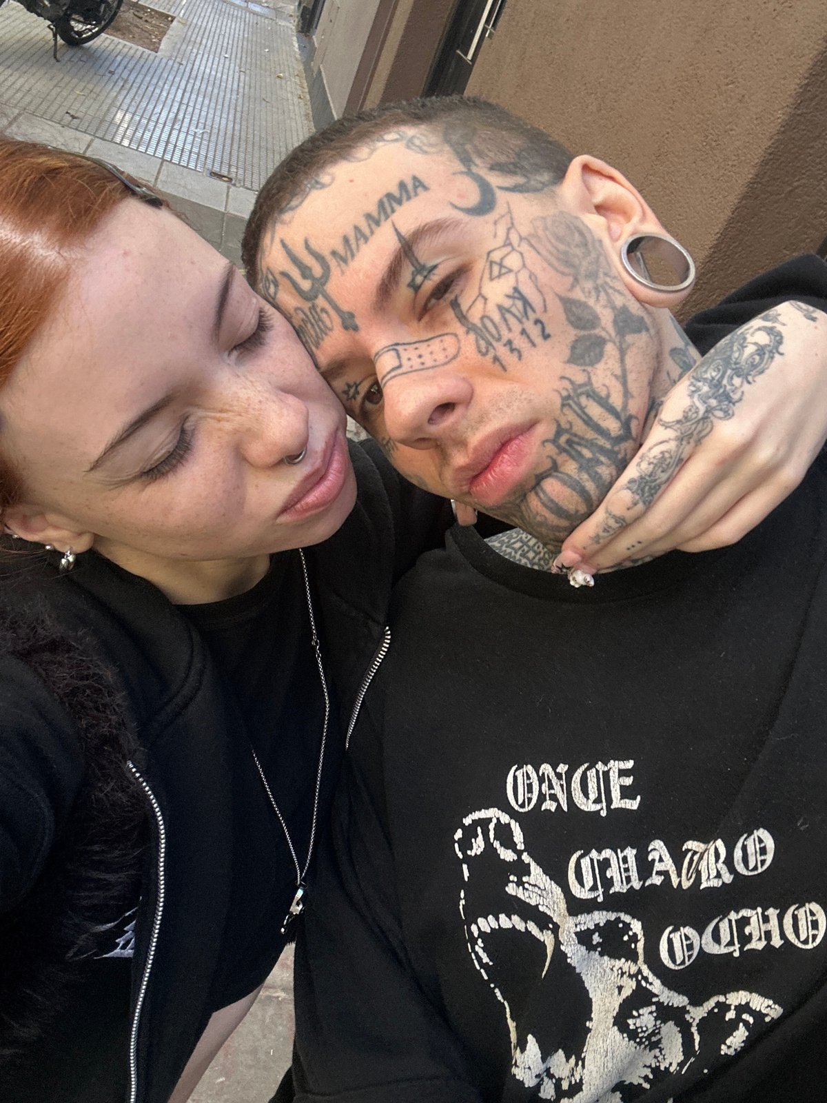 Couple embraces in Buenos Aires street scene