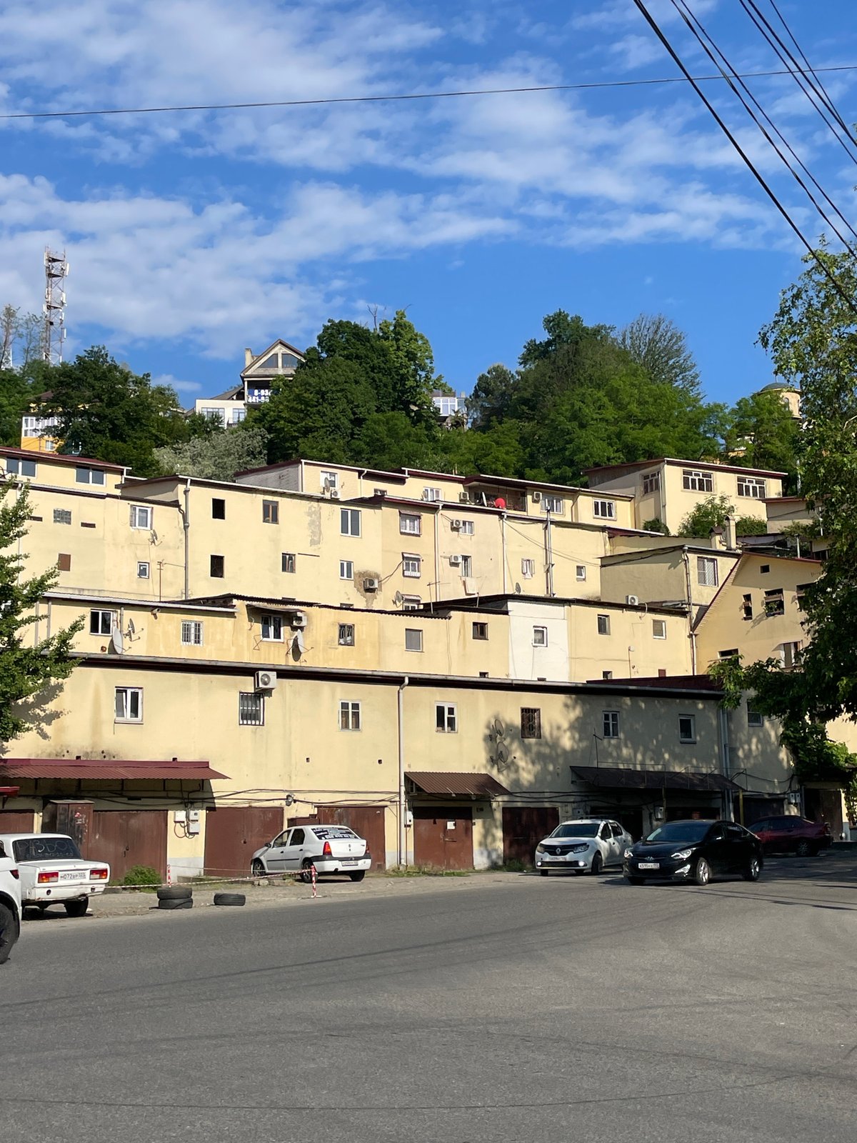 Woman documents afternoon river walk through Sochi, Russia