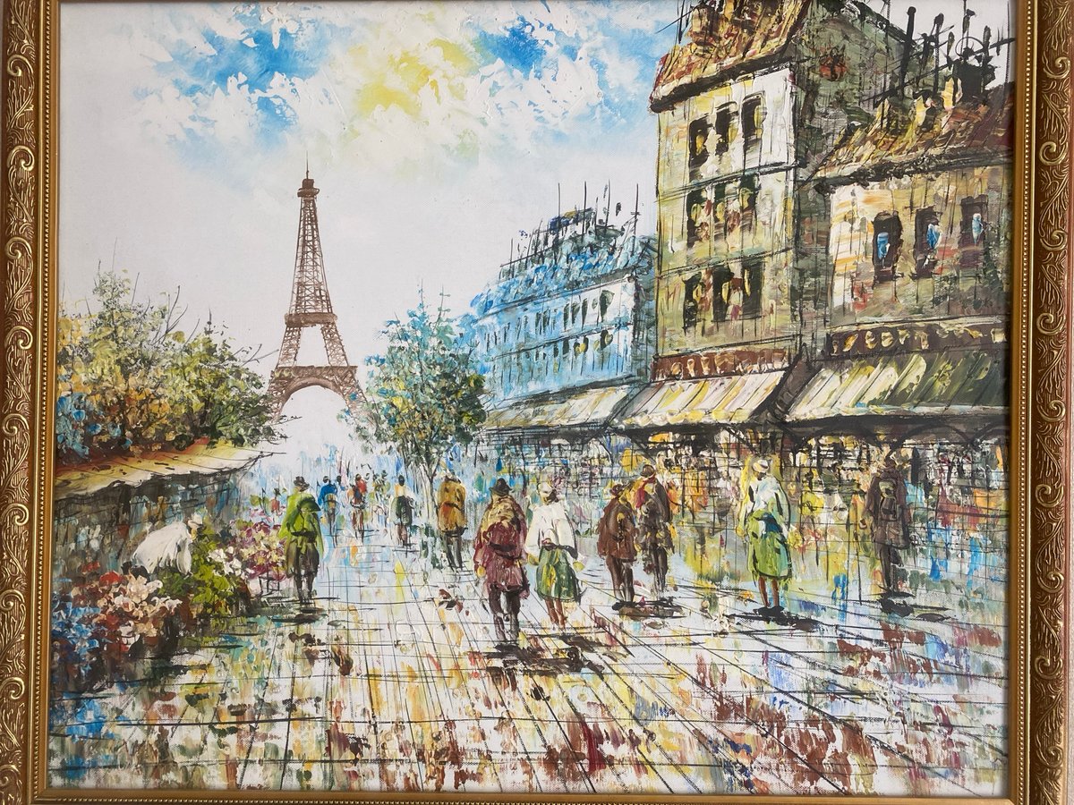 Person displays plush toy near Paris artwork documentation