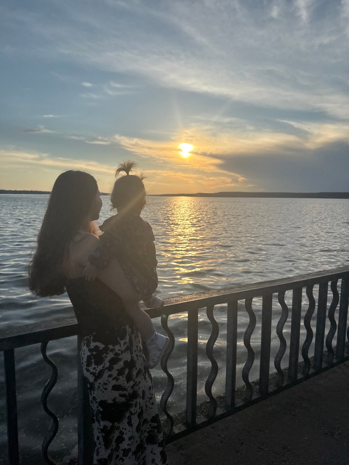 Family enjoys golden hour at Votkinsk waterfront promenade