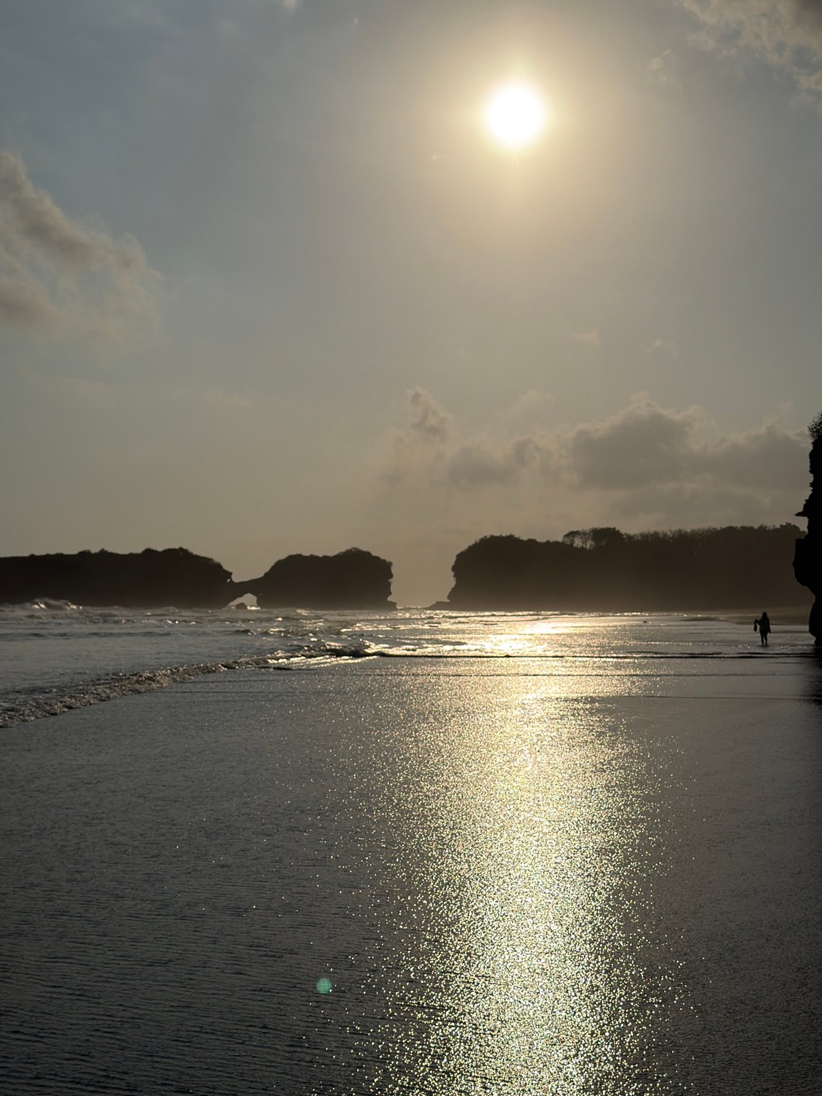 Slow morning on a remote Balinese beach at low tide