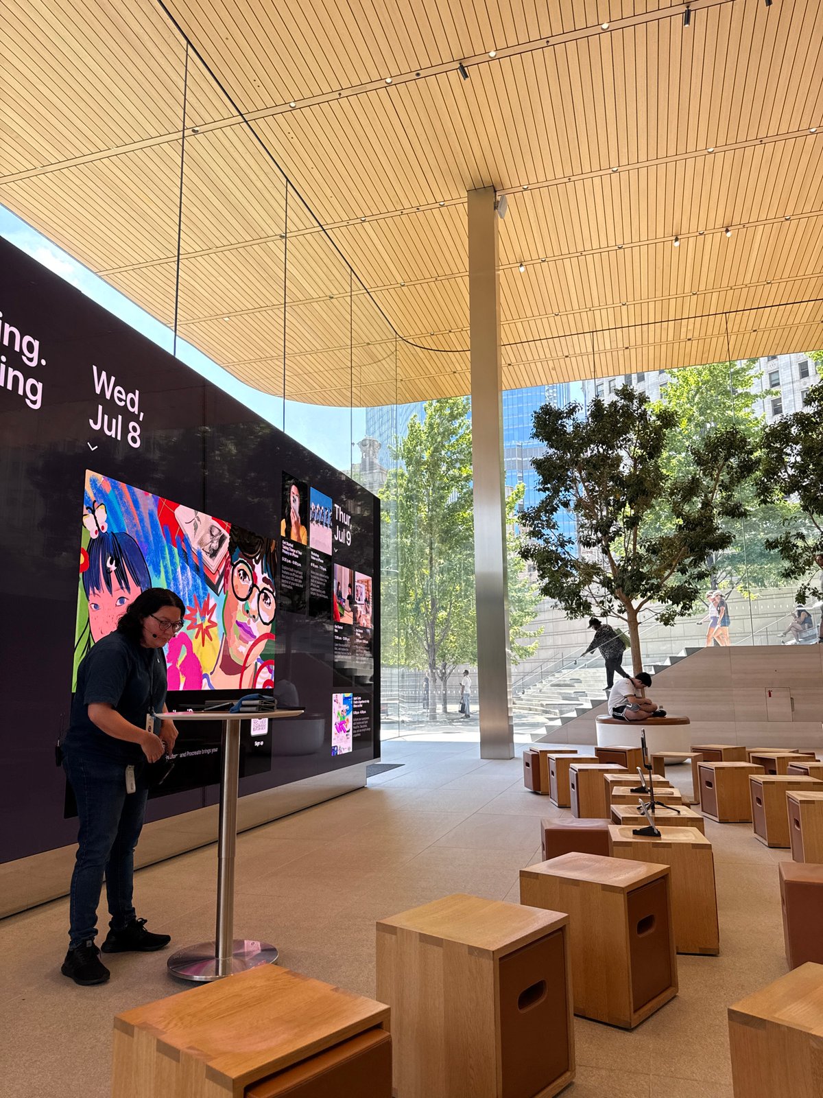 Inside and outside Apple's Michigan Avenue store on a summer evening