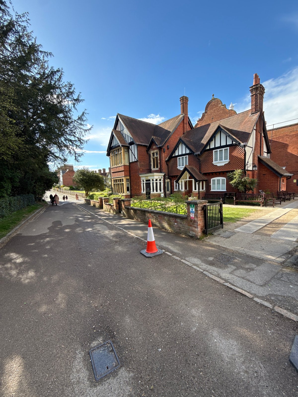 Tourist documents Tudor architecture during Berkhamsted town center stroll