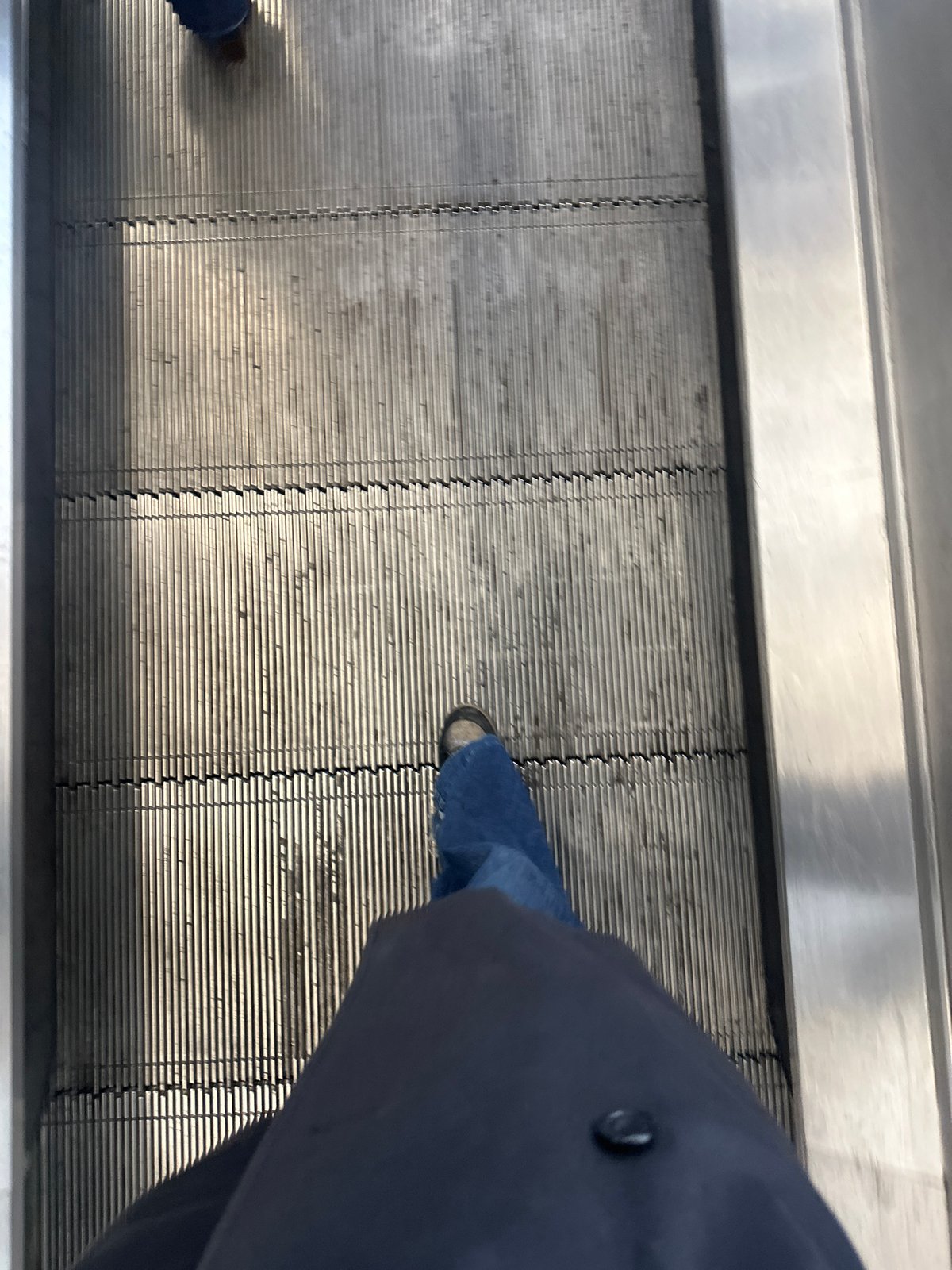 Person spotted on London Underground escalator during morning hours