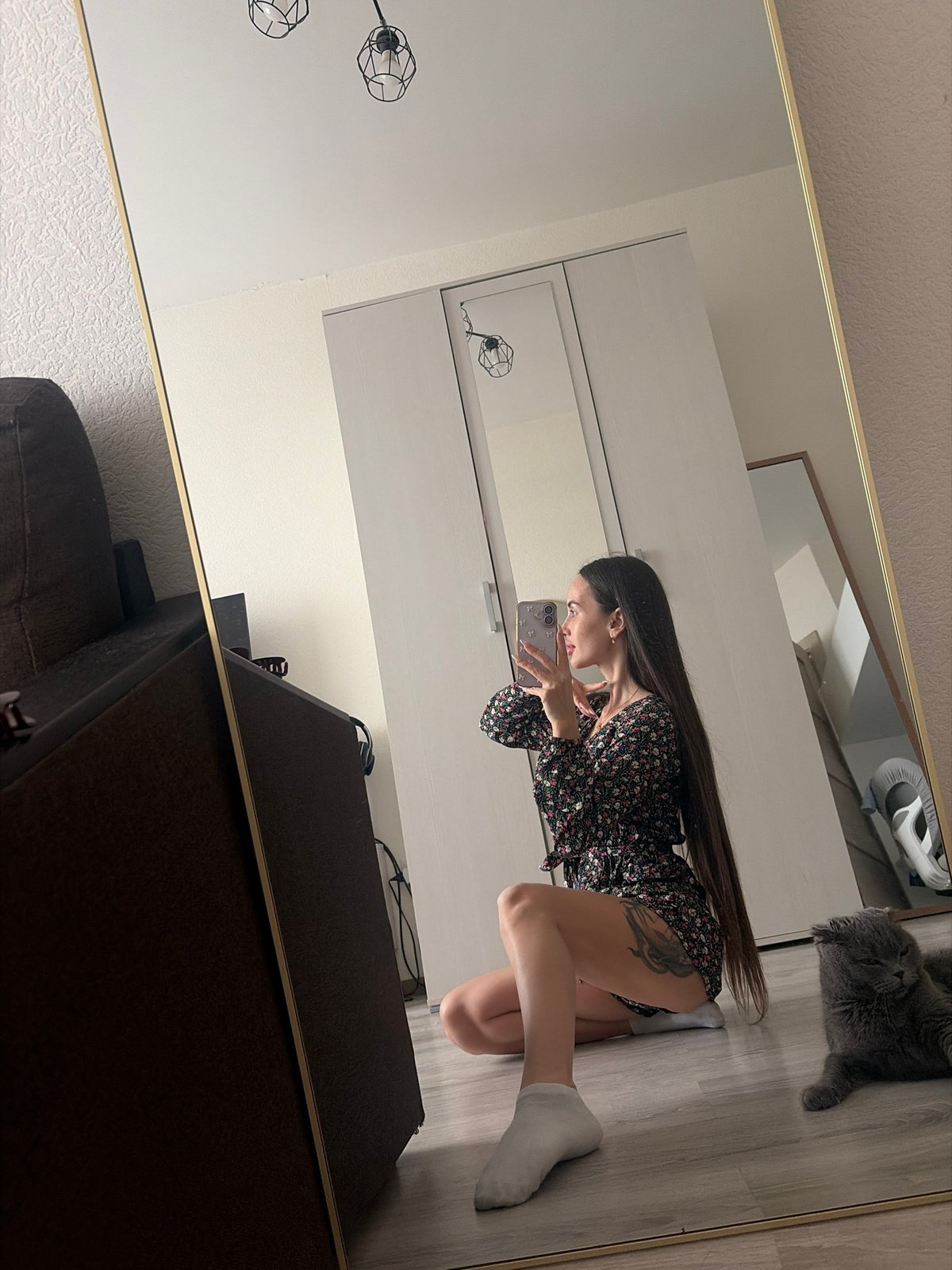 Woman takes mirror selfies indoors in Saint Petersburg