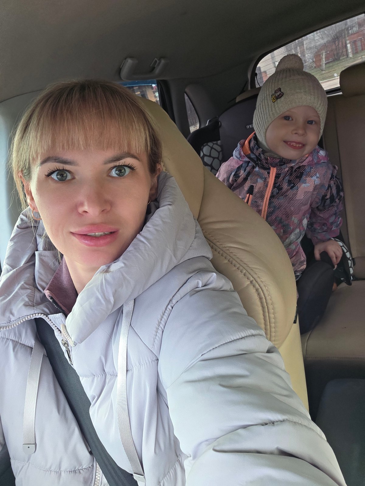Mother and child take car selfie in Chaikovsky