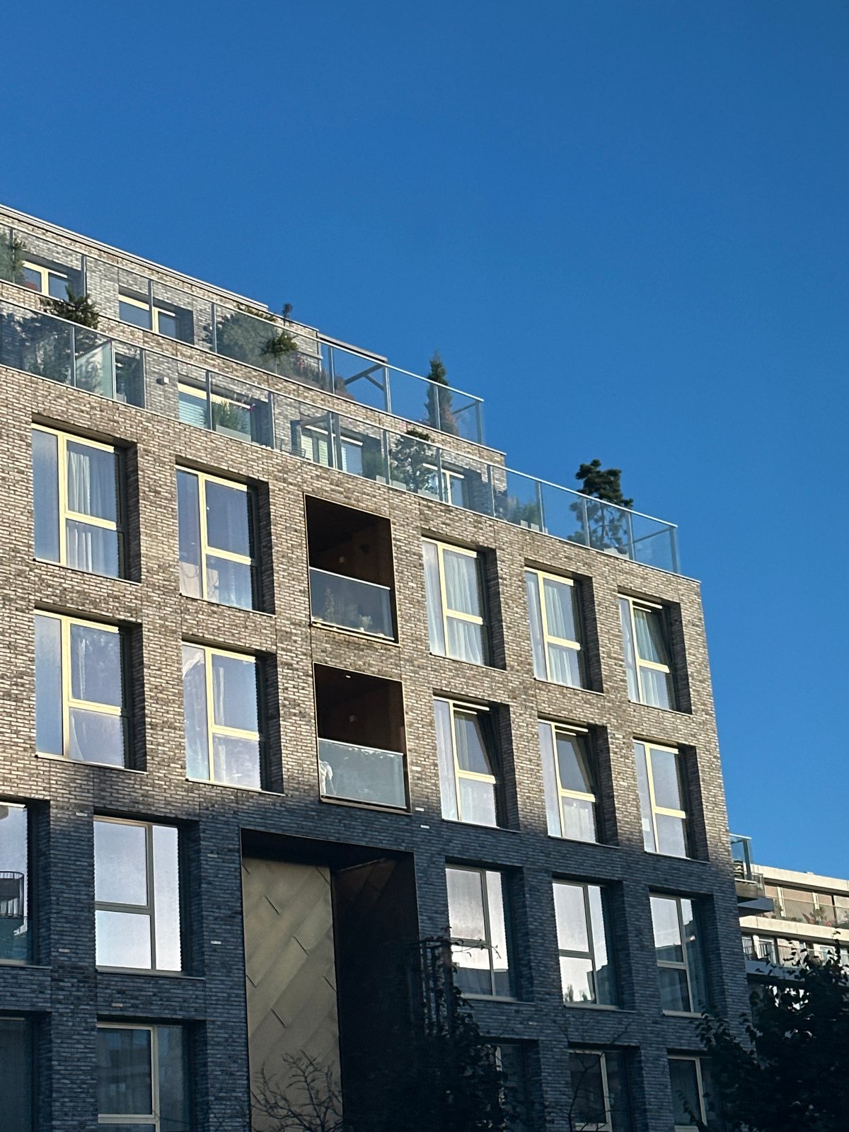 Exploring Amsterdam's modern residential architecture on a sunny afternoon