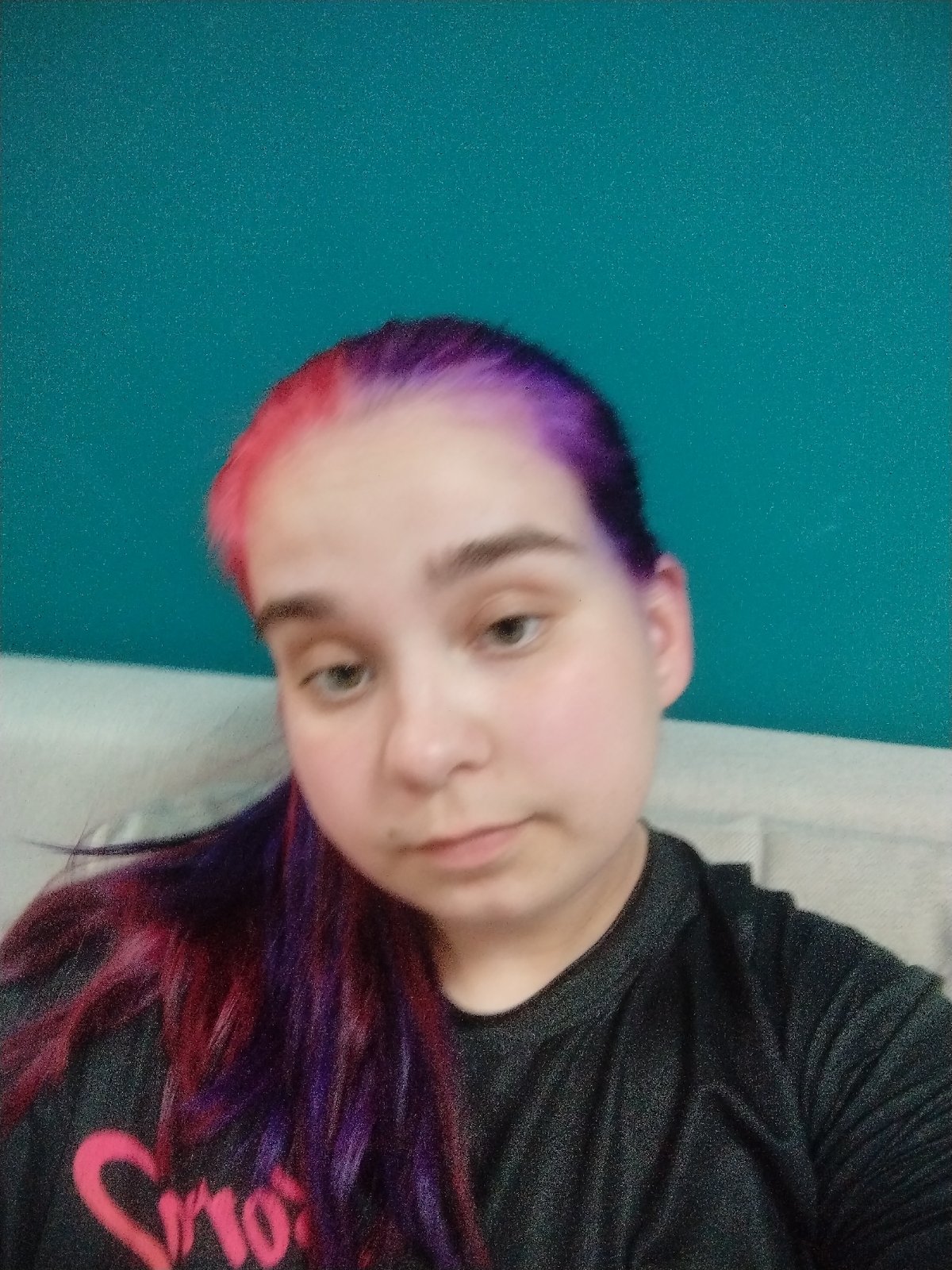 Woman displays colorful pink-purple hair dye in Plovdiv selfie