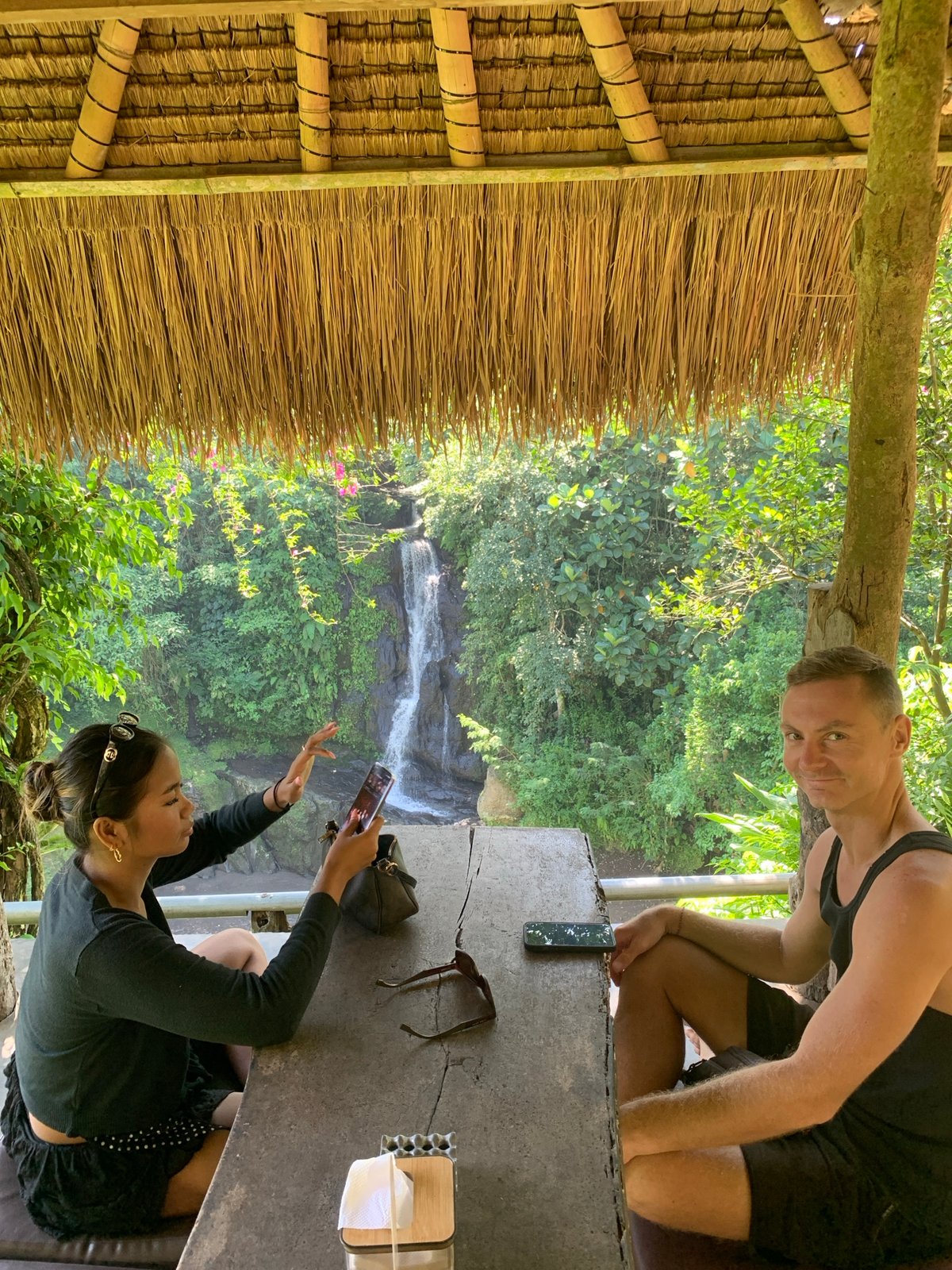 Waterfall dining experience in Blahbatuh's tropical landscape