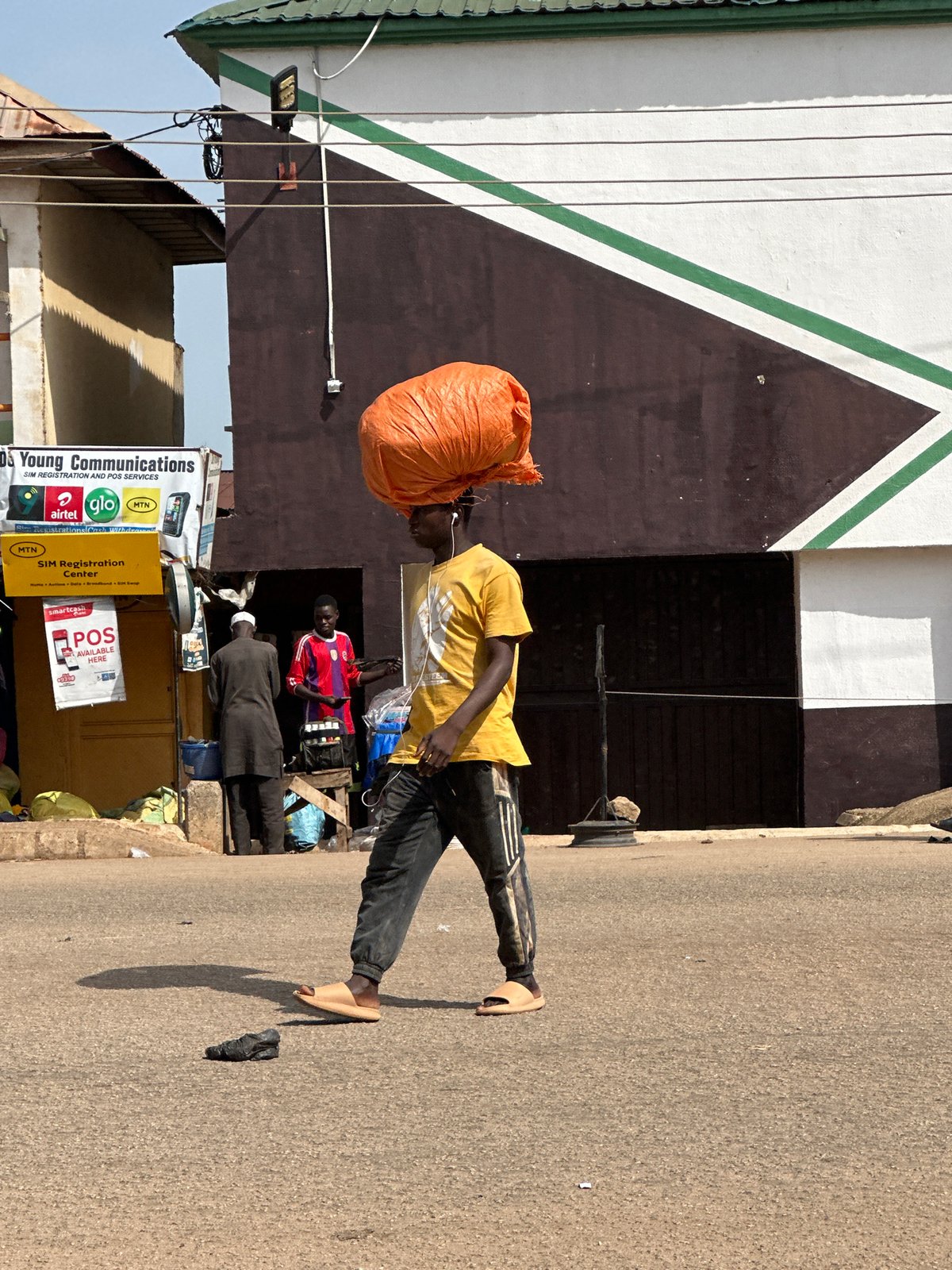 Morning street life and commerce in Bukuru, Nigeria