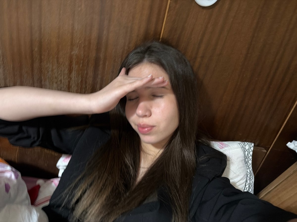 Woman rests in bed in Gabrovo, Bulgaria