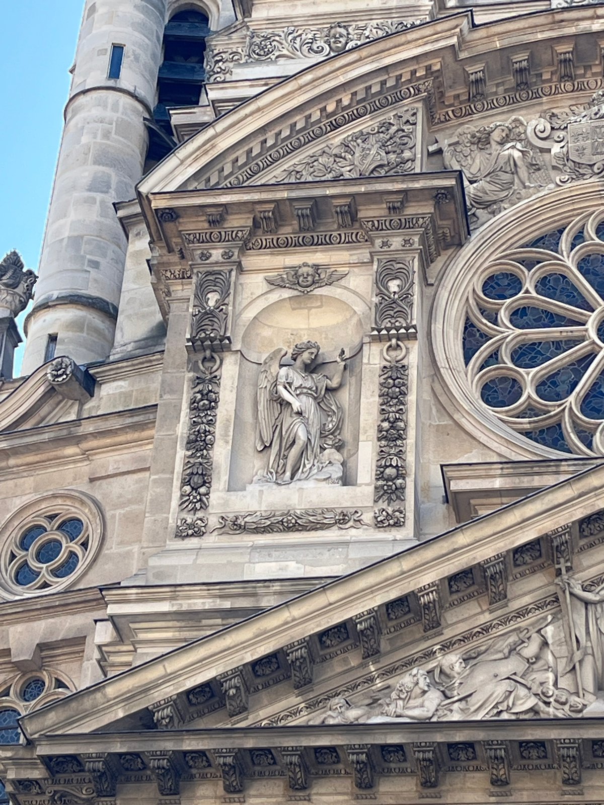Close look at the stone facade of Église Saint-Eustache, Paris