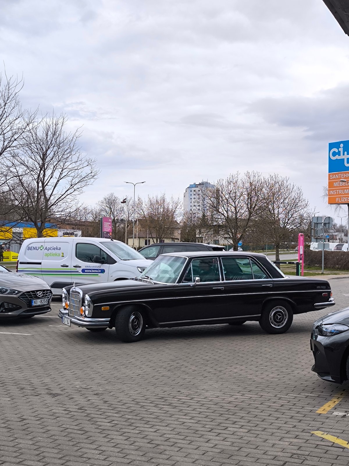 Everyday street scenes documented in Riga on cloudy afternoon
