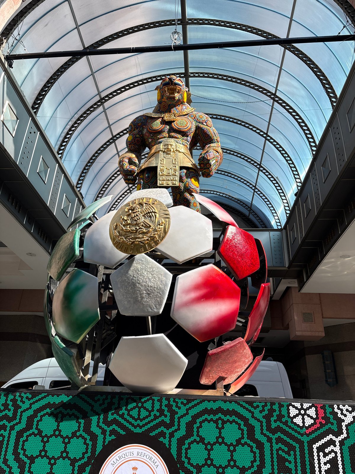 Beaded jaguar paw art installation observed in Mexico City