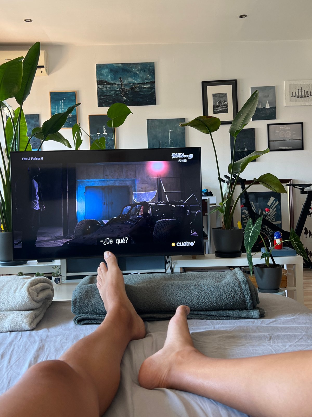 Person watches Fast & Furious 6 on TV in Spanish bedroom