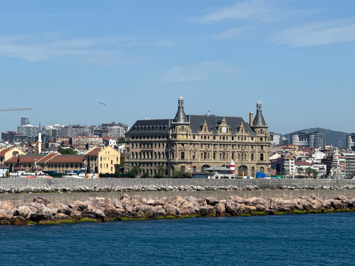 Ferry passengers document Haydarpaşa Terminal views from Istanbul waters