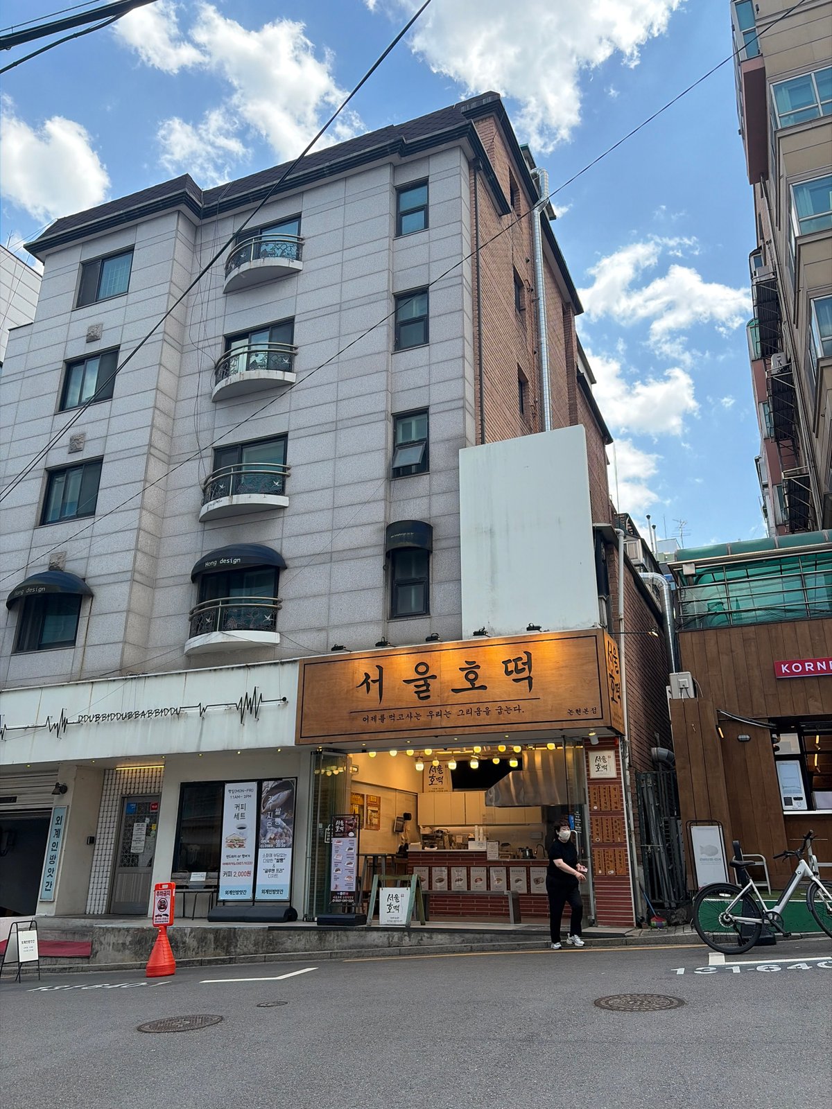 Early morning Seoul street scene captured with Korean signage