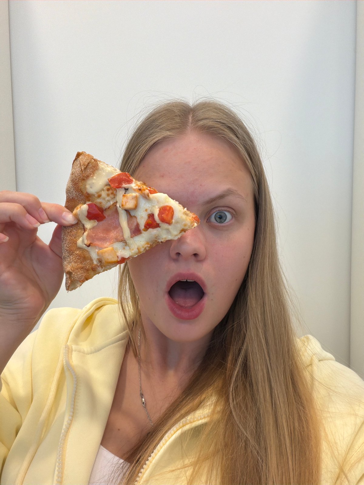 Woman enjoys pizza breakfast in Izhevsk, playful photos captured