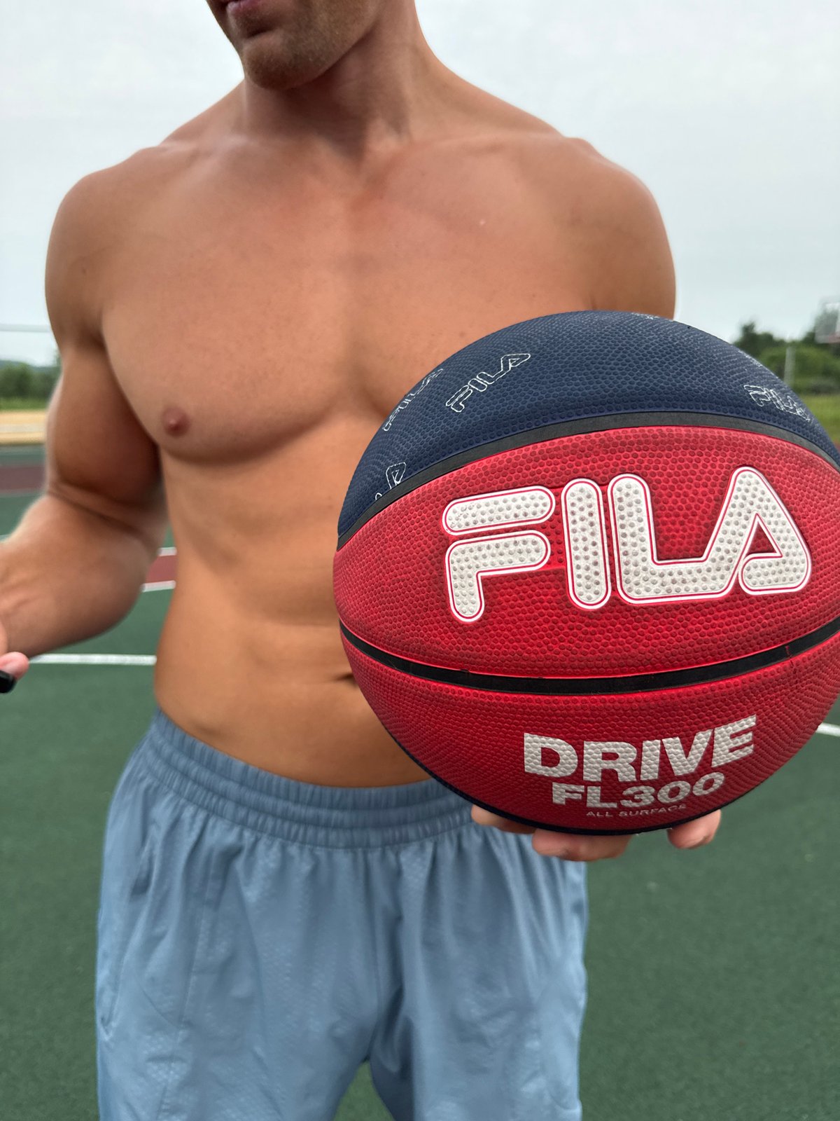 Fila basketball in hand on a Zelenogorsk outdoor court