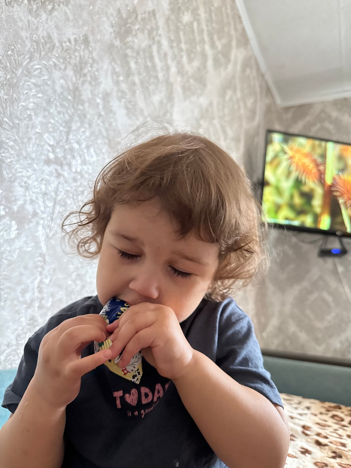Child portrait and digital hashtag graphic captured in Уральское