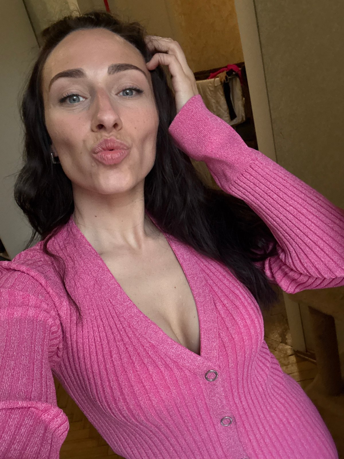 Woman takes multiple selfies indoors in Saint Petersburg