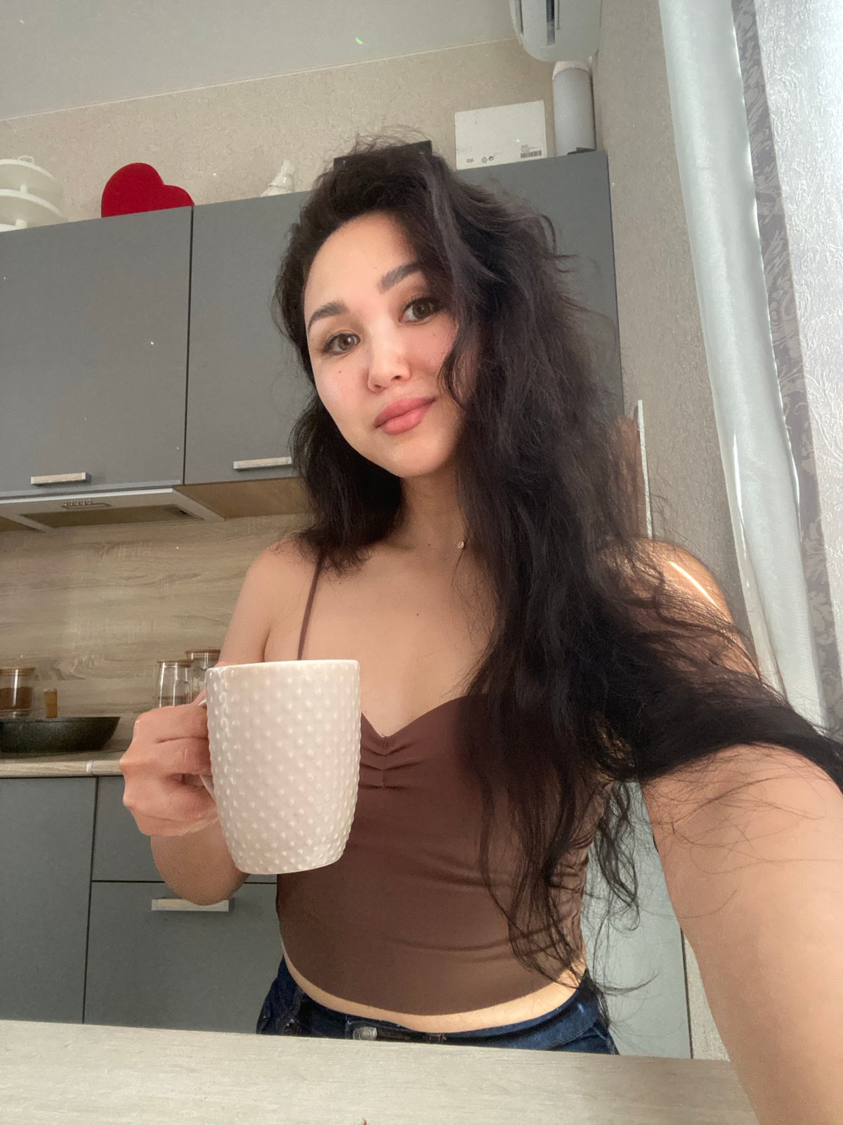 Woman documents morning cooking routine in Vysokoye, Russia