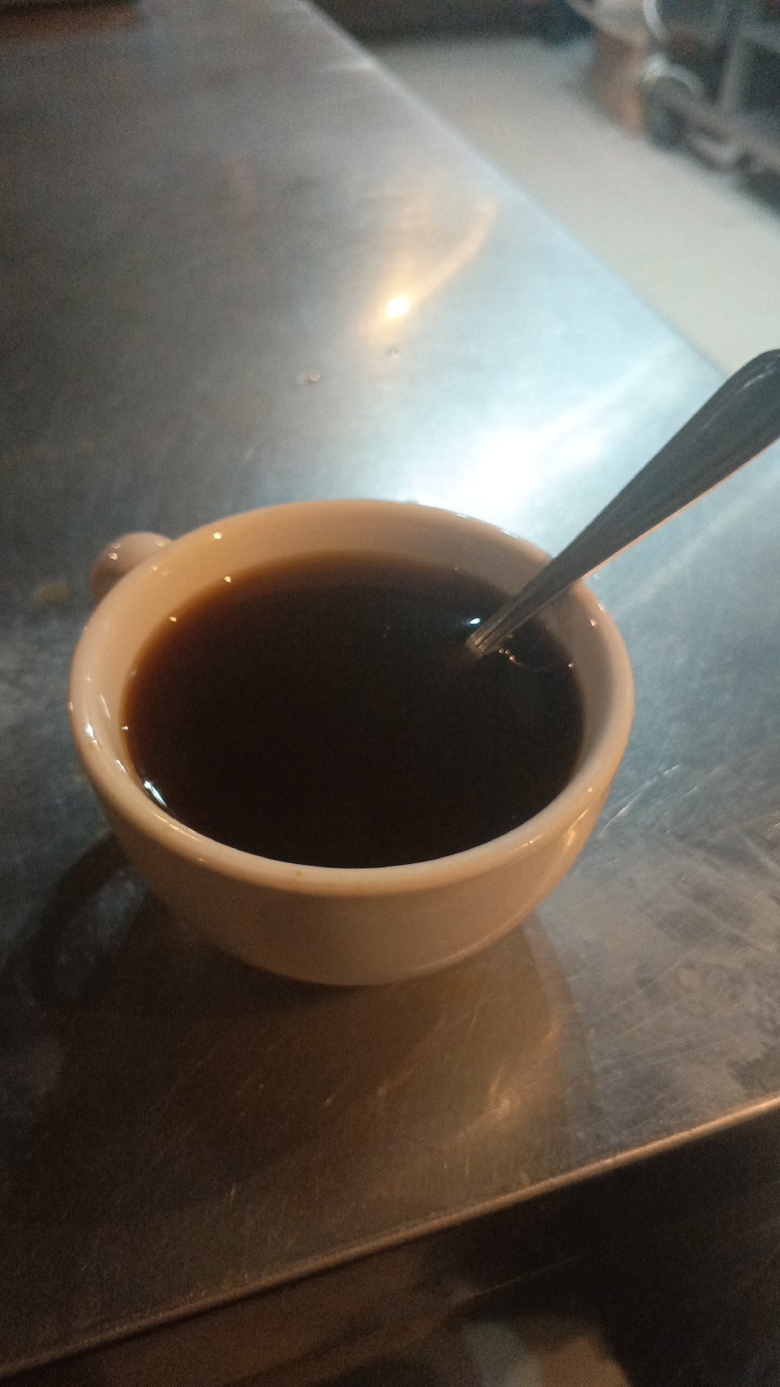 Coffee and spoon on a reflective surface in Mytishchi