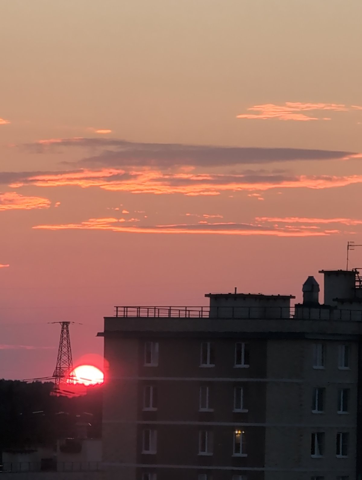 Saint Petersburg skyline glows under a summer evening sunset