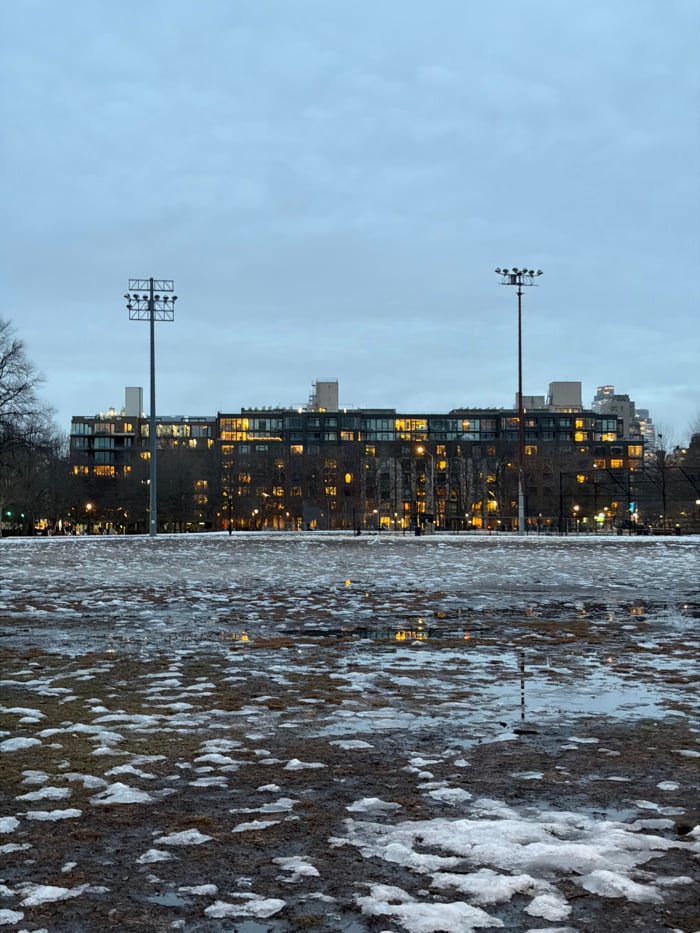 Dusk cityscape with melting snow documented in New York