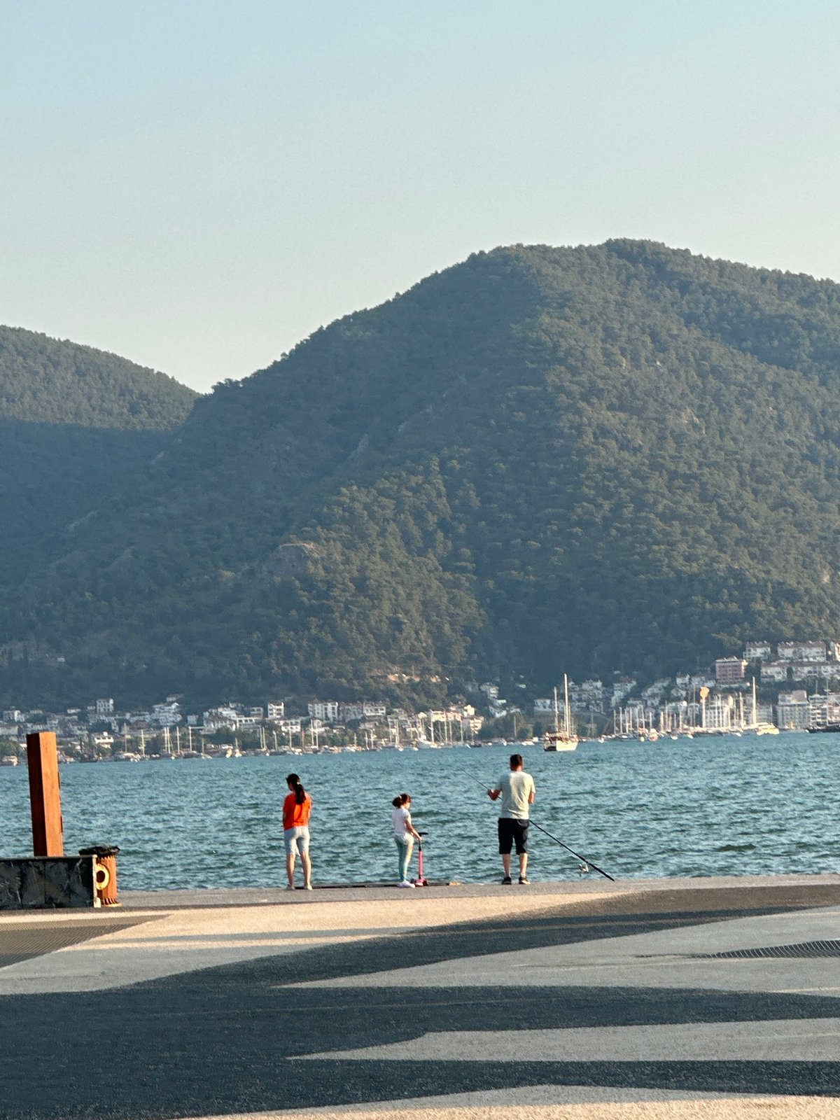 Evening stroll along Fethiye's waterfront promenade at sunset