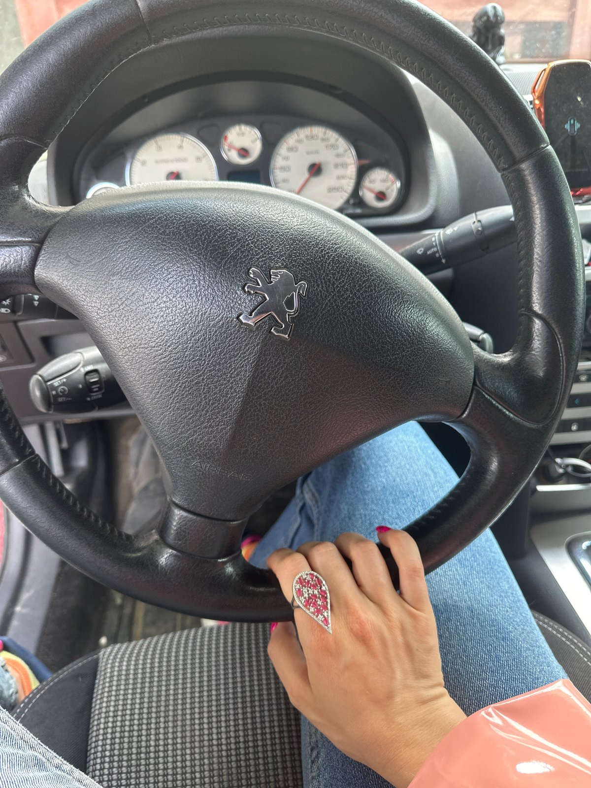 Woman photographed in Peugeot driver's seat in Vladimir, Russia