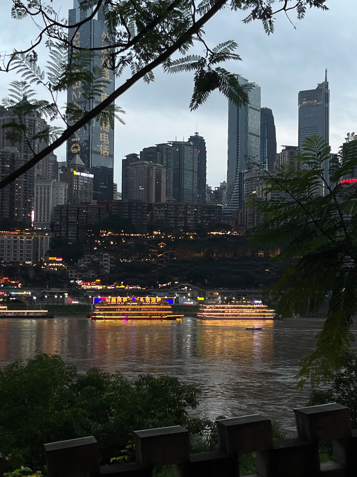 People gather at Chongqing riverside viewing areas during morning hours