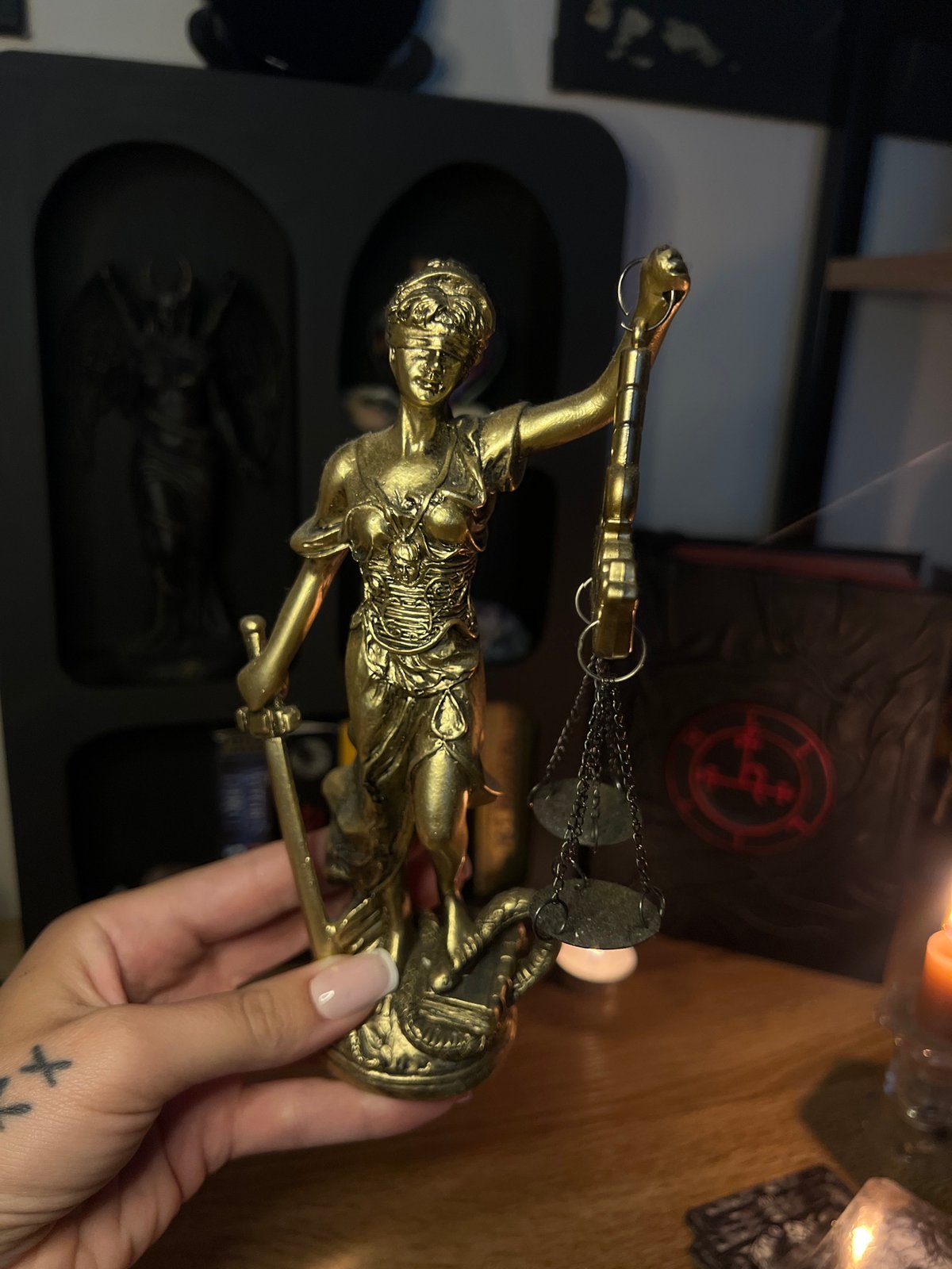Occult altar objects, tarot cards, and a Yorkshire Terrier at home